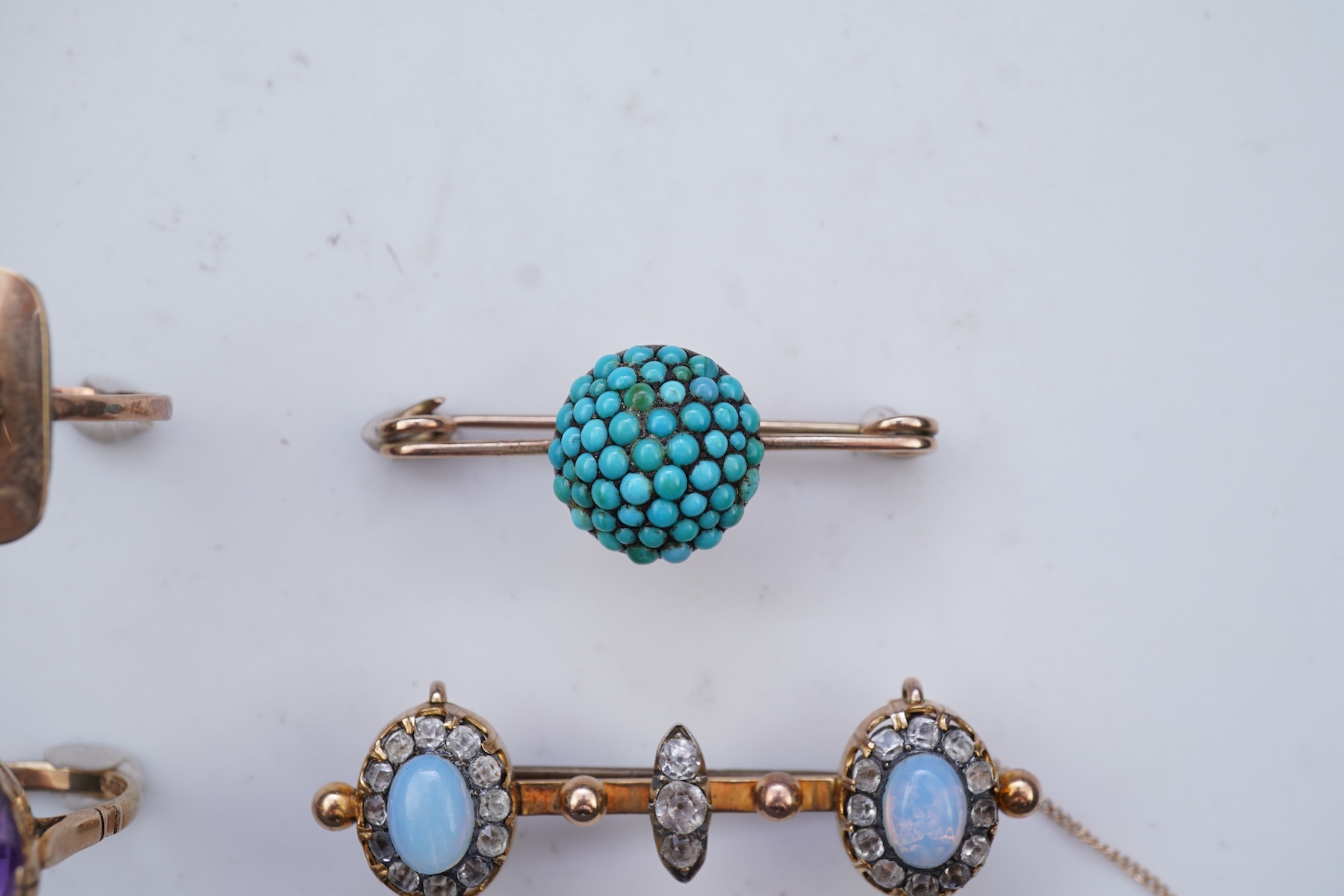 Three rings and a brooch
